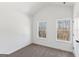 Comfortable bedroom with carpet flooring and natural light coming in through the dual windows at 3278 Greenhill Dr, Villa Rica, GA 30180