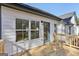 Inviting wooden deck showcasing windows and blue door perfect for outdoor relaxation at 3278 Greenhill Dr, Villa Rica, GA 30180