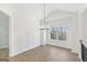 Elegant dining room featuring attractive wainscoting, modern lighting, and light hardwood floors at 3278 Greenhill Dr, Villa Rica, GA 30180