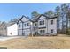Stylish two-story home with stone accents, a two-car garage, and a well-manicured lawn at 3278 Greenhill Dr, Villa Rica, GA 30180