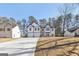 Lovely two-story house with a two-car garage, a long driveway, and attractive architectural details at 3278 Greenhill Dr, Villa Rica, GA 30180