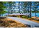 Exterior view of the lakeside Dockside Marina Restaurant, featuring lush green foliage at 3278 Greenhill Dr, Villa Rica, GA 30180