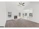 Bright living room features a vaulted ceiling, a cozy fireplace, and abundant natural light streaming through large windows at 3278 Greenhill Dr, Villa Rica, GA 30180