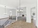 Open concept living room with hardwood floors, fireplace and modern lighting at 3278 Greenhill Dr, Villa Rica, GA 30180