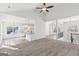 Open-concept living space includes a kitchen island, a spacious living area, and an abundance of natural light at 3278 Greenhill Dr, Villa Rica, GA 30180