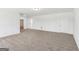 Expansive living room features neutral carpet and light-colored walls creating a blank canvas at 3278 Greenhill Dr, Villa Rica, GA 30180