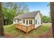 Home backyard features a small, wood deck in a green, wooded setting at 2279 Lakeview Pkwy, Villa Rica, GA 30180
