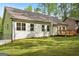 Level backyard with a small wood deck that is nestled in the woods at 2279 Lakeview Pkwy, Villa Rica, GA 30180