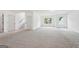 Spacious finished basement with neutral carpet, natural light, and access to the staircase at 2279 Lakeview Pkwy, Villa Rica, GA 30180