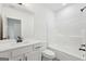 The bathroom is equipped with white cabinets and black hardware, alongside a shower and tub at 2279 Lakeview Pkwy, Villa Rica, GA 30180