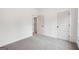 A clean, well-lit bedroom with light gray carpet and white doors and trim at 2279 Lakeview Pkwy, Villa Rica, GA 30180