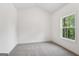 A modern bedroom with a view of the trees outside the window at 2279 Lakeview Pkwy, Villa Rica, GA 30180
