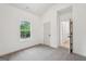 A serene bedroom featuring soft carpet and ample natural light at 2279 Lakeview Pkwy, Villa Rica, GA 30180