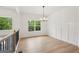 Dining room features elegant lighting fixture and large windows offering picturesque views of the outdoors at 2279 Lakeview Pkwy, Villa Rica, GA 30180