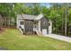 Beautiful two-story home with gray and white siding, wooden shutters, and a spacious front yard at 2279 Lakeview Pkwy, Villa Rica, GA 30180