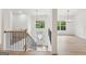 Bright foyer with hardwood floors, a staircase, and large windows providing natural light at 2279 Lakeview Pkwy, Villa Rica, GA 30180