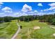 Scenic view of golf course with trees, sand traps, and green fairways at 2279 Lakeview Pkwy, Villa Rica, GA 30180