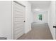 Bright hallway leads to a large finished room, offering a view of the backyard at 2279 Lakeview Pkwy, Villa Rica, GA 30180