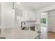 Bright kitchen features white cabinets, granite countertops, stainless steel appliances, and natural light at 2279 Lakeview Pkwy, Villa Rica, GA 30180