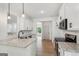 Bright kitchen features white cabinets, granite countertops, stainless steel appliances, and natural light at 2279 Lakeview Pkwy, Villa Rica, GA 30180