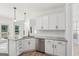 Bright kitchen features white cabinets, granite countertops, stainless steel appliances, and natural light at 2279 Lakeview Pkwy, Villa Rica, GA 30180