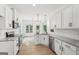 Modern kitchen with white cabinets, stainless steel appliances, granite countertops, and ample counter space at 2279 Lakeview Pkwy, Villa Rica, GA 30180