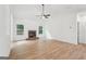 Large living room with ceiling fan and stone fireplace, offering a cozy and inviting space at 2279 Lakeview Pkwy, Villa Rica, GA 30180