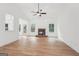 Spacious living room with vaulted ceiling, a stone fireplace, and large windows overlooking the backyard at 2279 Lakeview Pkwy, Villa Rica, GA 30180