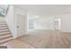Large living room with staircase and ample natural light at 2279 Lakeview Pkwy, Villa Rica, GA 30180