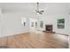Bright, airy living room with a stone fireplace and seamless access to outdoor spaces at 2279 Lakeview Pkwy, Villa Rica, GA 30180