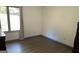 Bedroom with window and neutral walls and wood floor at 5526 Stoneleigh Court, Stone Mountain, GA 30088