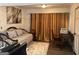 Cozy bedroom featuring a daybed, rich curtains, and a desk, creating a welcoming and versatile space at 5526 Stoneleigh Court, Stone Mountain, GA 30088