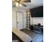Bedroom featuring built-in bookshelves and entertainment center with an electric fireplace at 5526 Stoneleigh Court, Stone Mountain, GA 30088