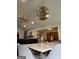 Bright dining room featuring a stylish light fixture and elegant marble table that complement the modern aesthetic at 5526 Stoneleigh Court, Stone Mountain, GA 30088