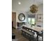 Bright dining area featuring stylish chandelier, a marble table, and elegant decor at 5526 Stoneleigh Court, Stone Mountain, GA 30088