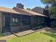 Home exterior featuring a screened in porch at 5526 Stoneleigh Court, Stone Mountain, GA 30088