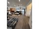 Spacious living room showcasing modern decor, vaulted ceilings, and an open layout leading to the dining area at 5526 Stoneleigh Court, Stone Mountain, GA 30088
