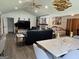 Spacious living area with modern décor, fireplace, ample seating, and seamless flow between living and dining areas at 5526 Stoneleigh Court, Stone Mountain, GA 30088