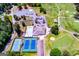 Beautiful aerial view of community amenities including pool, tennis courts, clubhouse, and golf course at 3279 Greenhill Dr, Villa Rica, GA 30180
