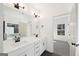 Modern bathroom features a double sink vanity, quartz countertops, and sleek fixtures at 3279 Greenhill Dr, Villa Rica, GA 30180