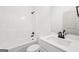 Bright white bathroom features a shower and tub combo with modern fixtures at 3279 Greenhill Dr, Villa Rica, GA 30180