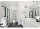 Modern bathroom with a glass-enclosed shower, double vanity, and black fixtures at 3279 Greenhill Dr, Villa Rica, GA 30180