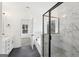 Elegant bathroom featuring a glass-enclosed shower and a luxurious soaking tub at 3279 Greenhill Dr, Villa Rica, GA 30180