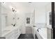Bright bathroom featuring double sinks, a large mirror, and stylish fixtures at 3279 Greenhill Dr, Villa Rica, GA 30180