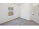 Bright bedroom featuring neutral walls, plush gray carpeting, and a window offering natural light at 3279 Greenhill Dr, Villa Rica, GA 30180