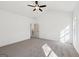 Spacious bedroom featuring a ceiling fan, plush carpet, and bright natural light at 3279 Greenhill Dr, Villa Rica, GA 30180