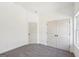 Neutral bedroom with carpet, multiple doors and natural light from a window at 3279 Greenhill Dr, Villa Rica, GA 30180