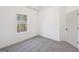 Bright bedroom featuring neutral walls, plush gray carpeting, and a window offering natural light at 3279 Greenhill Dr, Villa Rica, GA 30180