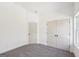 Cozy bedroom featuring neutral carpeting and a double door closet at 3279 Greenhill Dr, Villa Rica, GA 30180