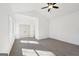 Sunny bedroom with a ceiling fan, large windows, and a double door closet at 3279 Greenhill Dr, Villa Rica, GA 30180